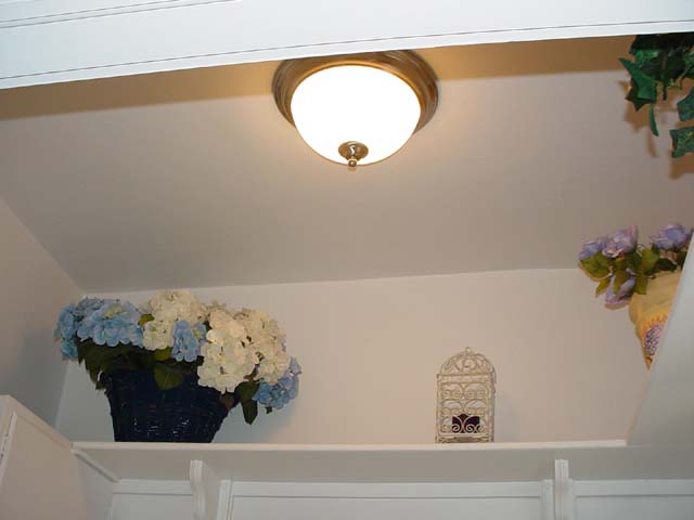 149 Mater Bathroom Light and Floral Shelving